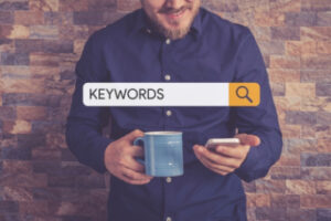 Man entering keywords in to mobile device
