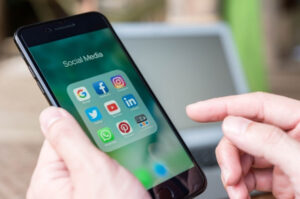 Person using social media on mobile device
